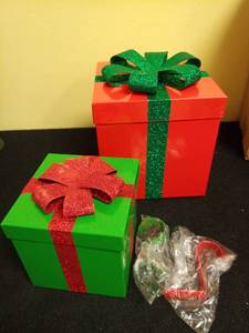 lot 1031 image: Zcaukya 2 Pack Christmas Stocking Holders Red and Green Metal Gift Box Stocking Hangers Mantel Stocking Hooks for Christmas Decoration Retail $28.99