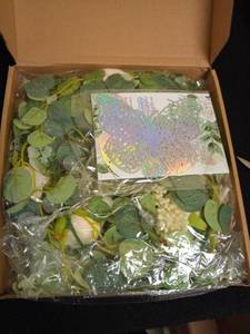lot 1148 image: Yastouay 6.4 Ft Fuller Flower Garland with Light Butterfly, Artificial Eucalyptus Garland with Champagne Flowers Fake Rose Camellia Vine Garland for Table Centerpiece Wedding Arch Room Decor Retail $26.48