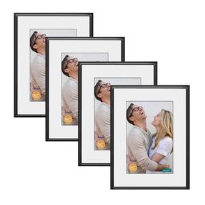 lot 29964 image: DECANIT 8x10 Picture Frame Black Metal Thin Frames Display Pictures 5x7 with Mat or 8x10 Without Mat Gallery Wall Frame Kit For Wall or Tabletop Display Pack of 4,Black