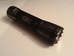 Eight  LED combat flashlight 6 inches long has LED light laser pointer built-in batteries not included