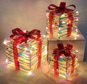lot 21956 image: Mosy Set of 3 Lighted Gift Boxes Christmas Decorations, 48 LED Transparent Lighted Boxes, Christmas Home Gift Box Decorations - Retail $9470.1