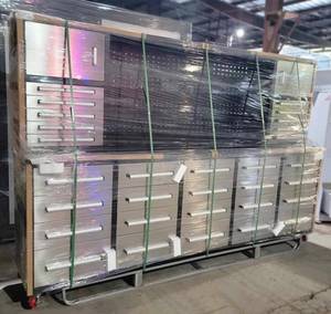 lot 33 image: Unused Steelman 10 Stainless Steel Garage Cabinet Workbench (30 Drawers & 2 Cabinets) - The Perfect Addition To Your Workspace. It Is An All-In-One Workstation That Provides You With a Pegboard, Drawers & Cabinets for Maximum Organization.