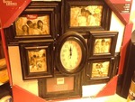 Nice family photo frame with Clock in middle as pictured