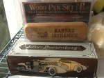 Antique cologne car and Kansas Jayhawk pen in wooden case as pictured