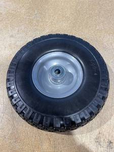 lot 1928 image: Spare Tire 9.5 in x 3 in. NOT FOR HIGHWAY USE.