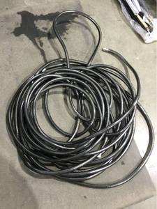 lot 3956 image: NeverKink Teknor Apex 58-in x 100-ft Heavy-Duty Kink Free Vinyl Gray Coiled Hose