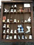 Collection of tymbols with display case decorative item