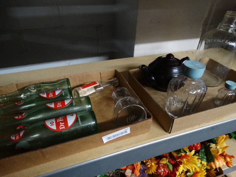 lot 764 image: Old dr pepper bottles, cocacola glass ware, half gallon glass jar, & tea pot.