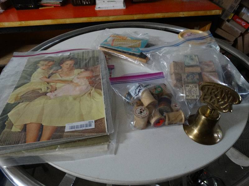 lot 801 image: Lot of stamps, posters, thread and metal bell.