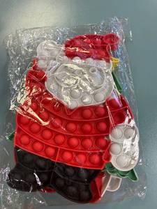lot 2253 image: (4) Piece Christmas pop it toy set