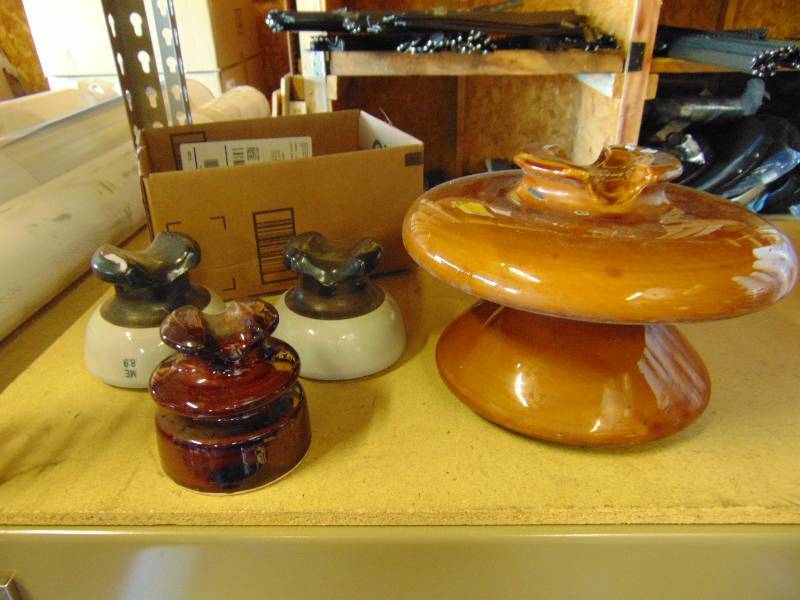 lot 7043 image: (4) ct. lot ceramic insulators, assorted sizes