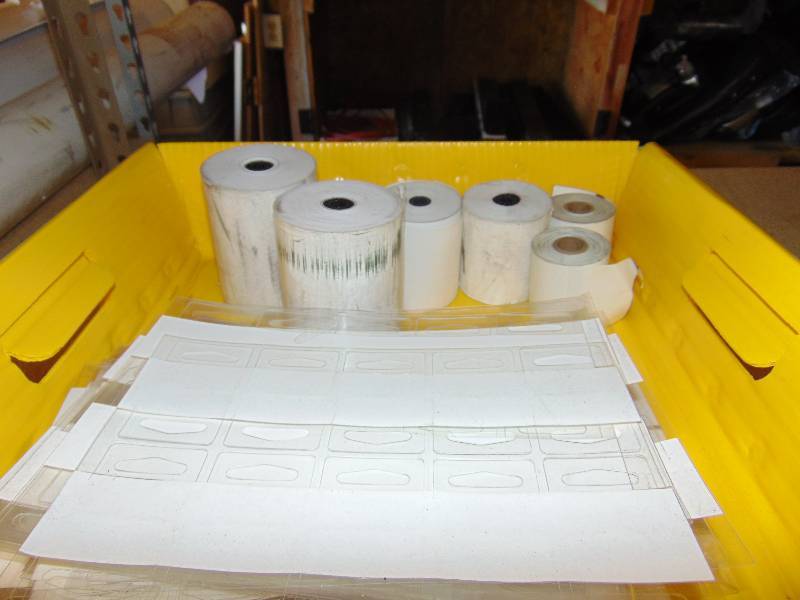lot 7056 image: Mixed lot of sales supplies thermal receipt paper, merchandising tabs, plastic size hangers, over 20 pieces