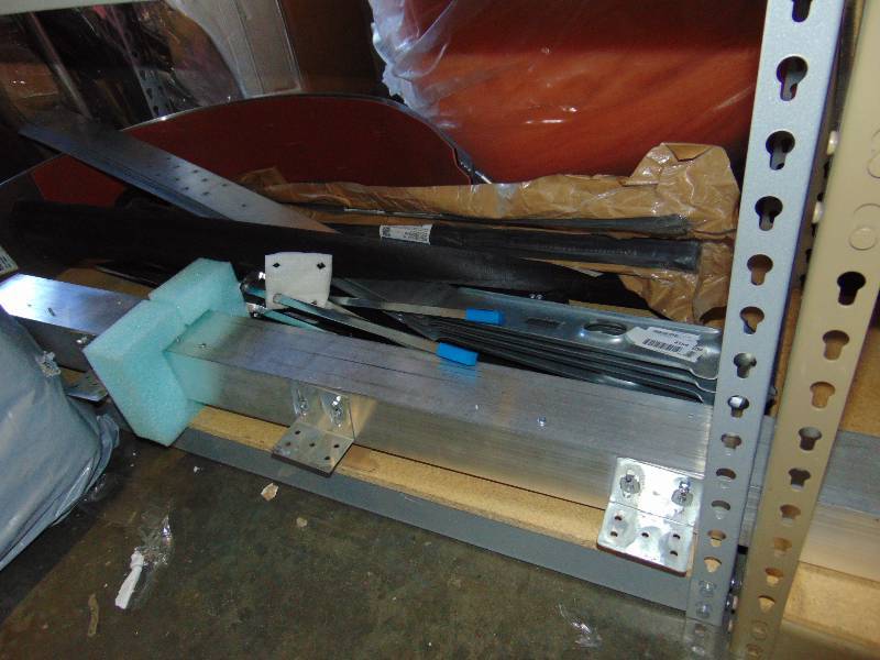 lot 7059 image: contents of shelf aluminum raceway, adjustable sign post, banding strap and more