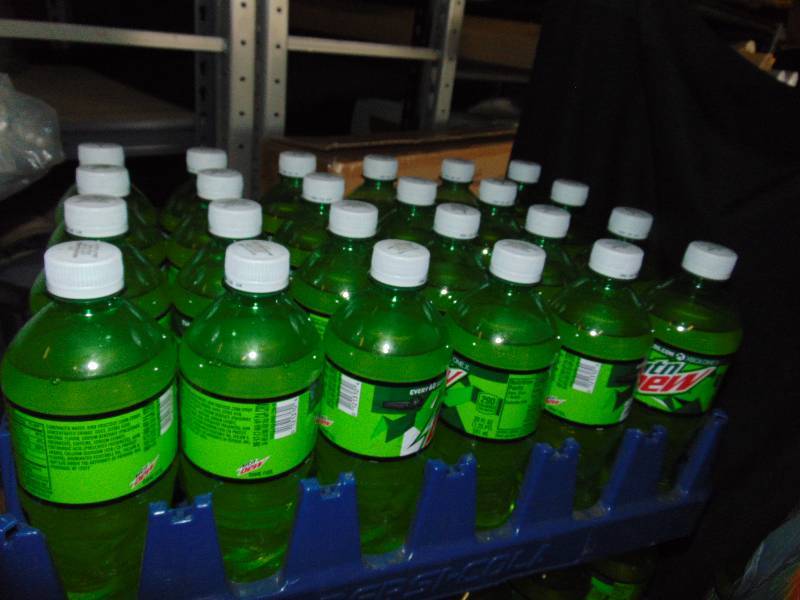 lot 7222 image: (24) 20 bottles Mountain Dew in plastic Pepsi Crate