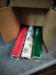 lot 1932 image: Gift Wrap Ensemble 3 Rolls Of Wrapping Paper, 4 Ribbons, 40 Seals, And 10 Bows