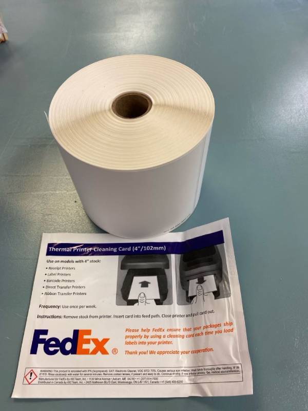 lot 2243 image: Moisturizer resistant packing labels 425 per roll. Comes with thermal cleaning card