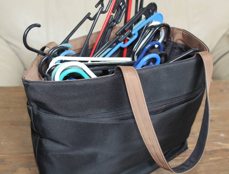 lot 7421 image: Zipper Bag w 30 Plastic Hangers Included