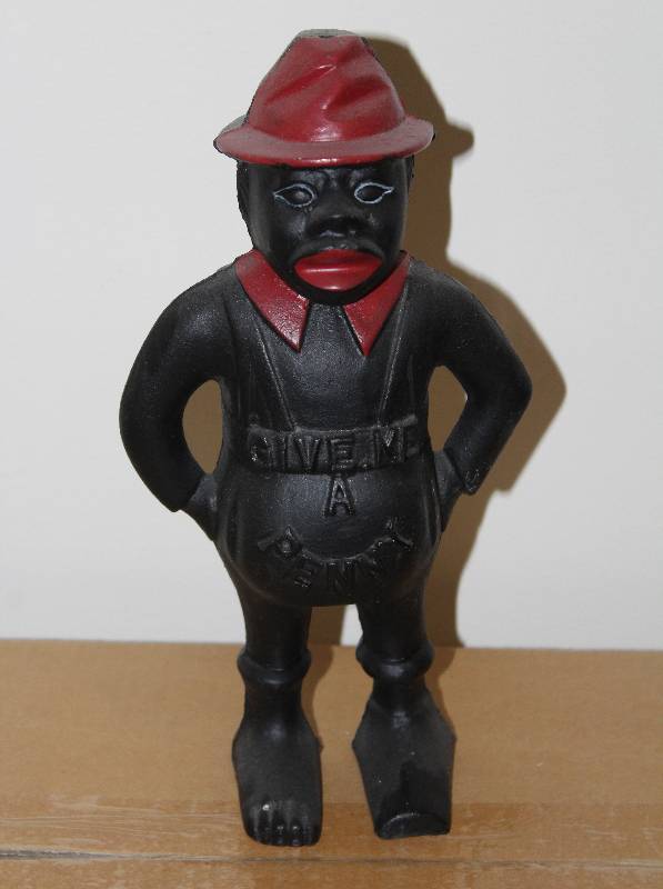 lot 7469 image: Cast Iron Bank- Give Me a Penny- Cool