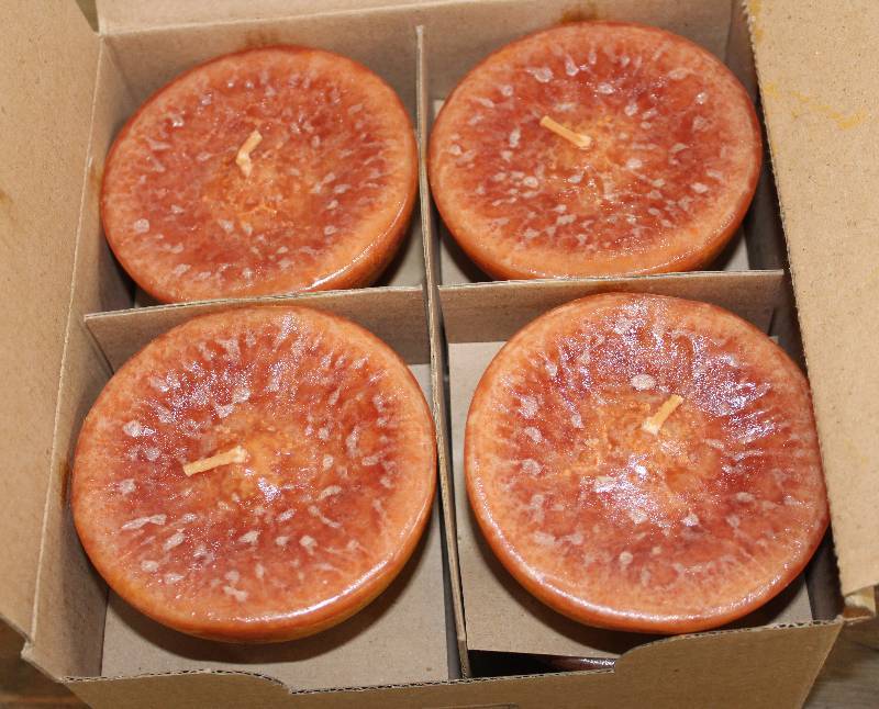 lot 7484 image: Box of 8, 3.5 Inch Half Ball Orange Spice Scented Candles- Very Neat