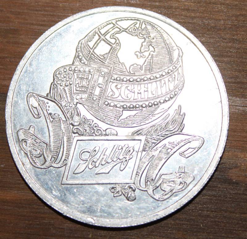 lot 7593 image: Schlitz Mardi Gras Token of 1977- Very Cool