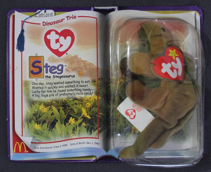 lot 9839 image: 2000 McDonalds Happy Meal Toys � Dinosaur Trio Steg Teenie Beanie. Original Pkg