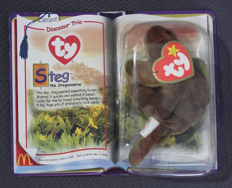 lot 9847 image: 2000 McDonalds Happy Meal Toys � Dinosaur Trio Steg Teenie Beanie. Original Pkg