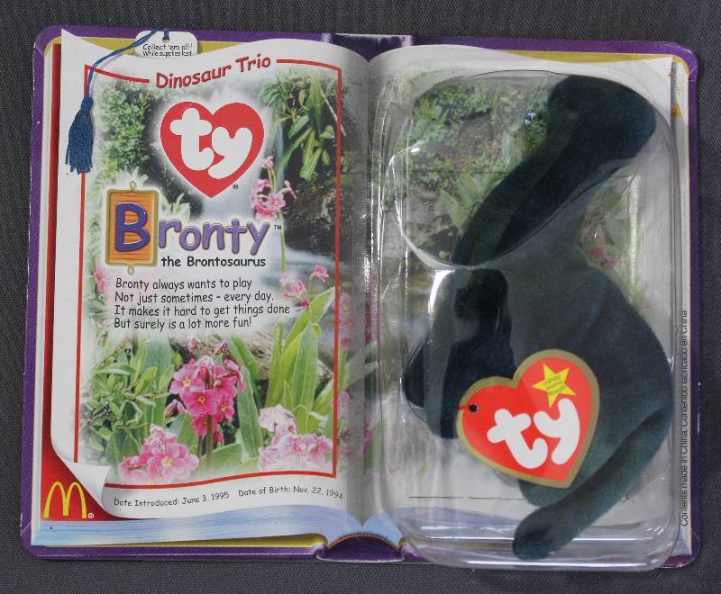 lot 9857 image: 2000 McDonalds Happy Meal Toys � Dinosaur Trio Bronty Teenie Beanie. Original Pkg