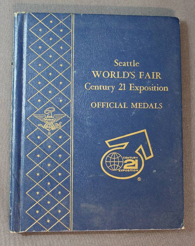 lot 9889 image: Seattle Worlds Fair Century 21 Exposition Official Medals Book with 1962 Medal Inside
