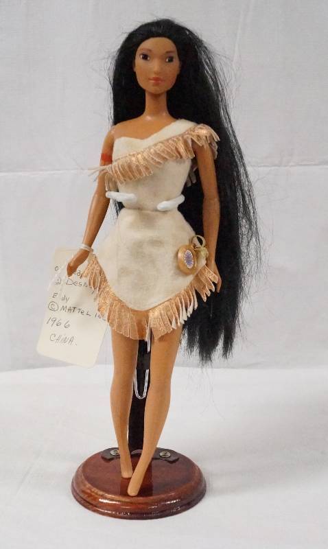lot 6215 image: Native American Doll- Head Labeled Desney, Body Labeled Mattel Inc.- Stand Included