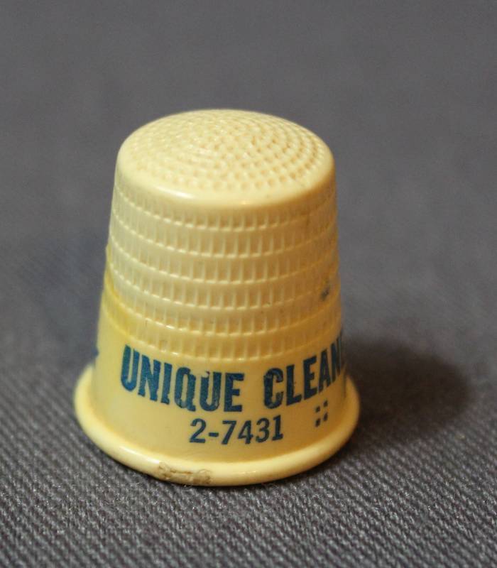 lot 4060 image: Unique Cleaners & Launders Plastic Thimble - Pottorff Brothers 2-7431