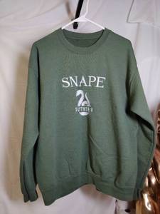 lot 316 image: SLYTHERIN What appears to be a womens Size L NO TAG