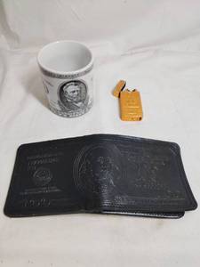 lot 332 image: 100 Dollar Bill Wallet, 50 Dollar Bill Coffee Mug and Fake Gold Bar Lighter