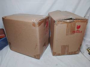 lot 1007 image: 2 Mystery Boxes, all it says on the boxes is RED TRUCK