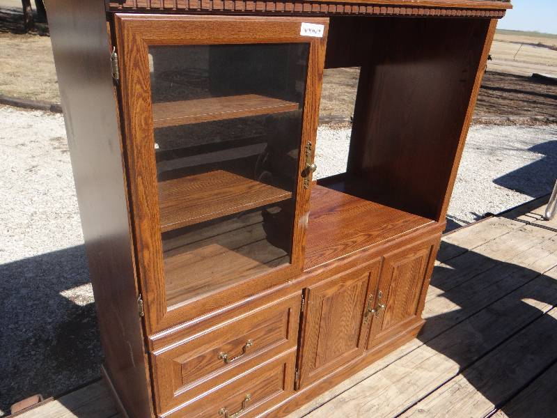 lot 745 image: Entertainment center wglass door & 2 drawer.
