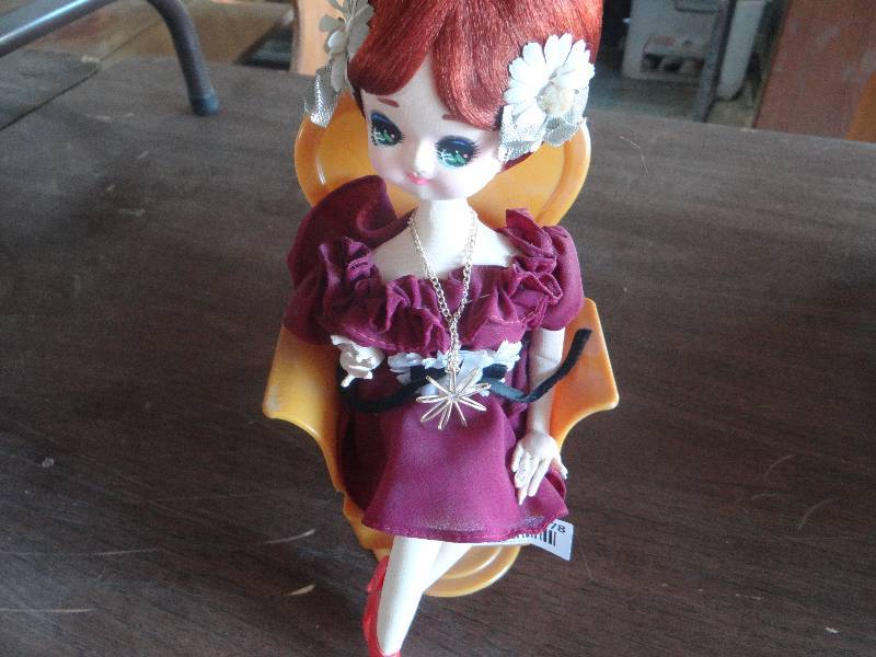 lot 778 image: Rubber doll in salour chair.