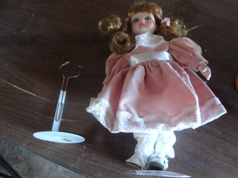 lot 779 image: Standing porcelain doll.