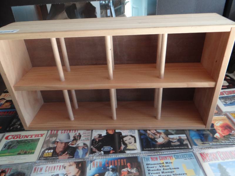 lot 789 image: Large volume of new country CDs wwood shelf.