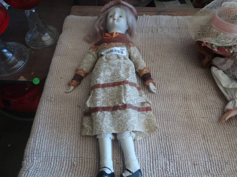 lot 810 image: Antique ceramic doll.