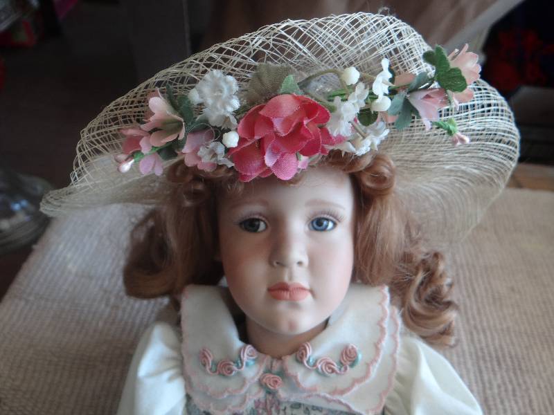 lot 811 image: Antique ceramic doll.