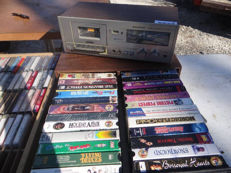 lot 839 image: Cassetts, VHS, & cassette player.