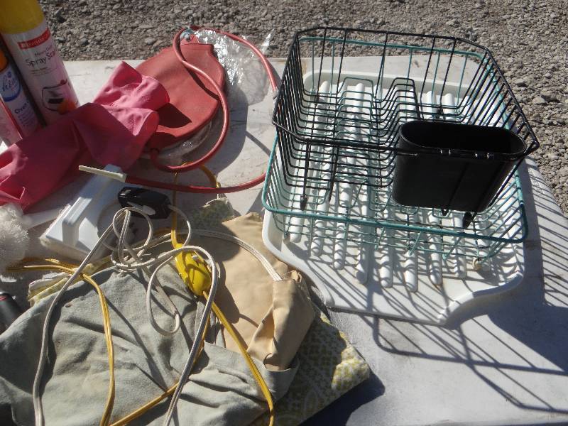 lot 846 image: Heating pads, rubber hanging water bottle, inflatable rafts, & kitchen items.