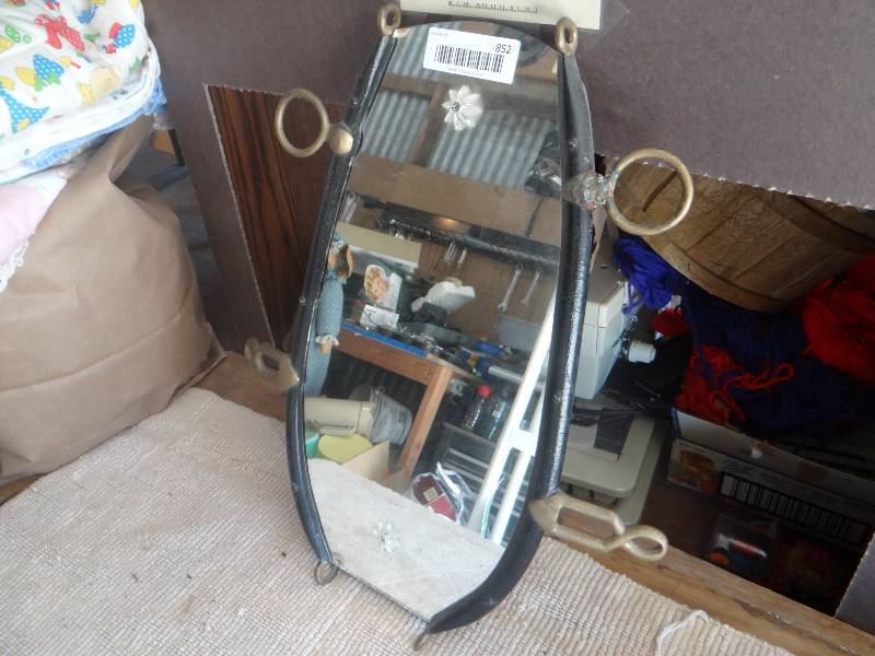 lot 852 image: Old wall mirror in heavy metal frame.