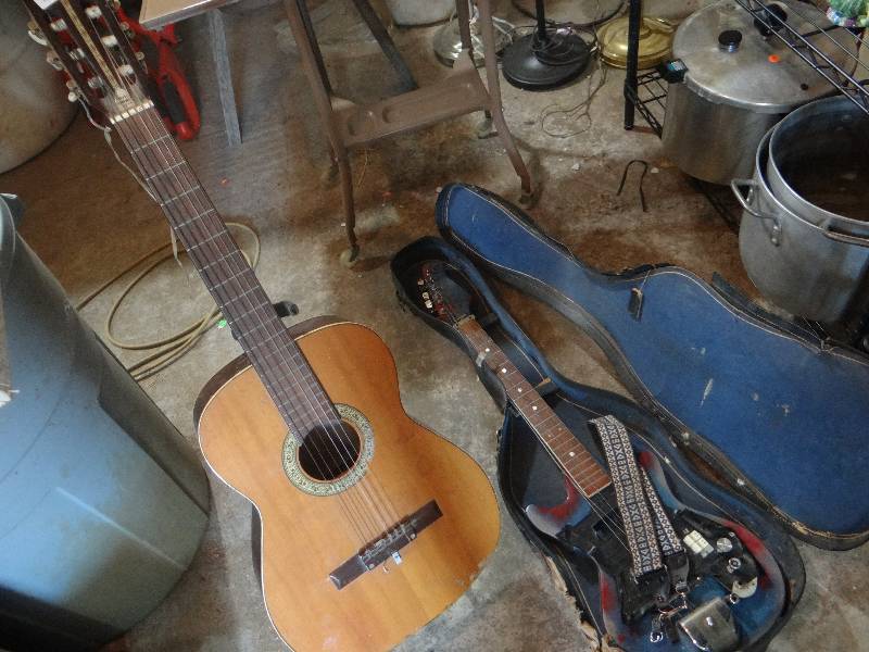 lot 879 image: 2 guitars with stand and case.
