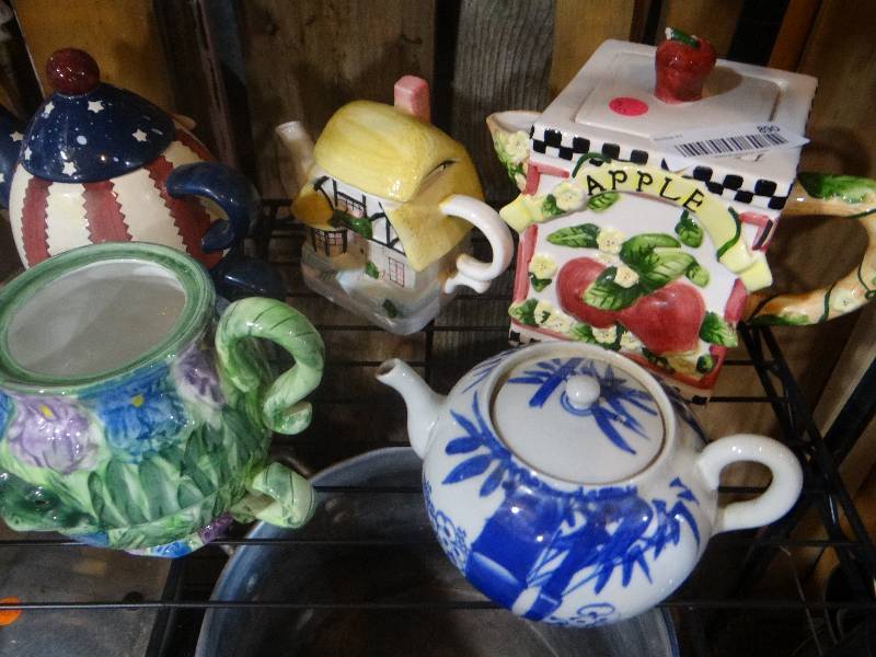 lot 890 image: Antique lamp and tea pots.