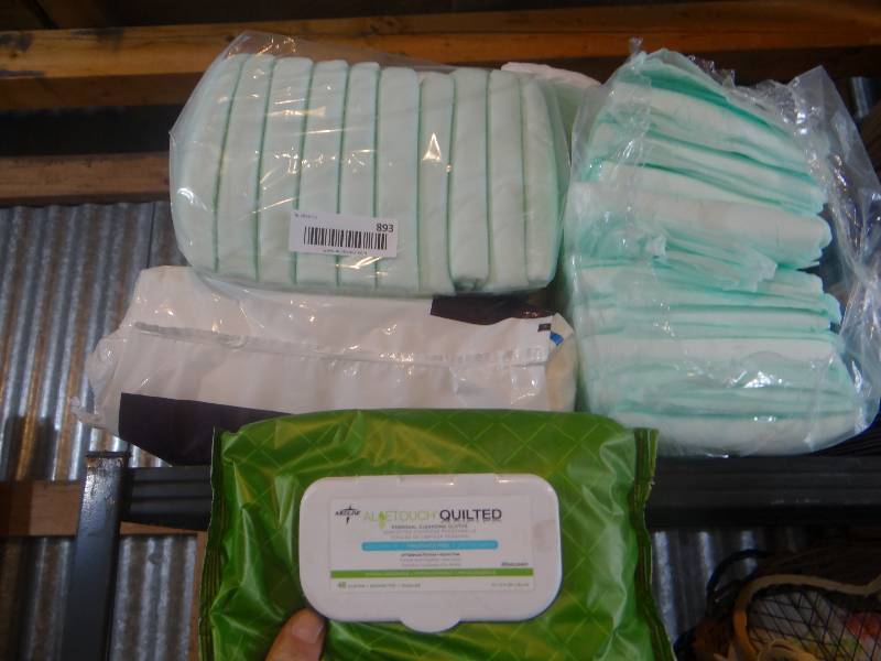 lot 893 image: Adult diapers and cleaning wipes.