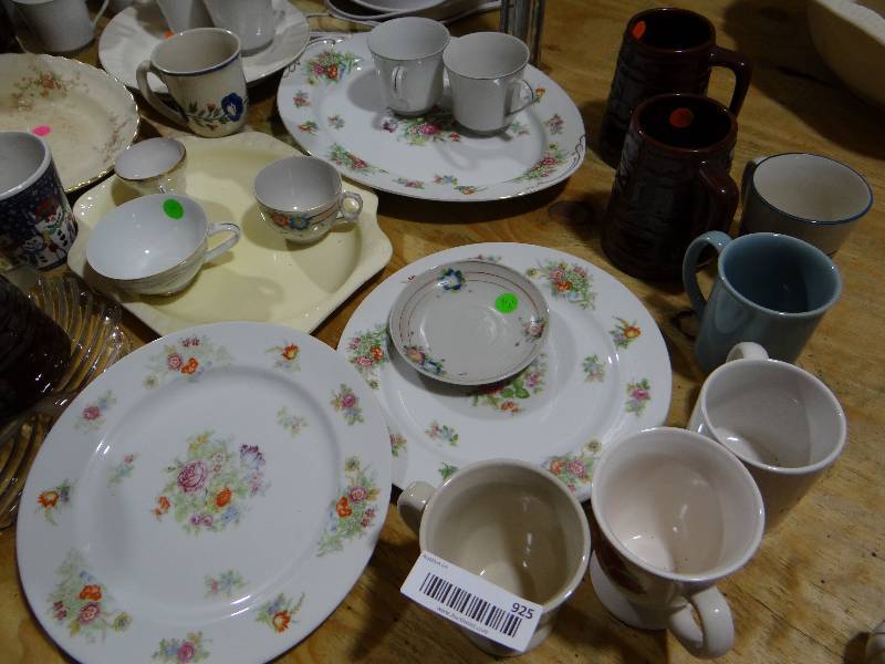 lot 925 image: Large lot of glassware mugs, plates, and platters.