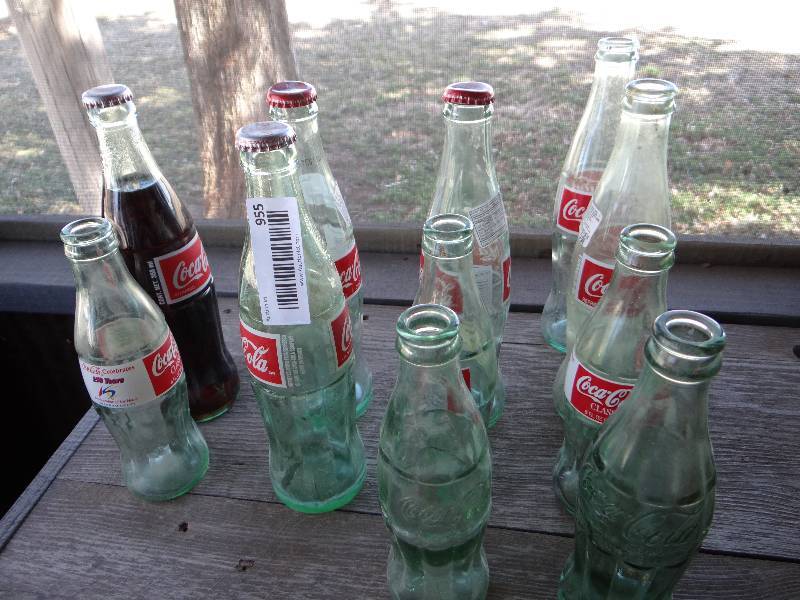 lot 955 image: Lot of 11 Coca Cola bottles.