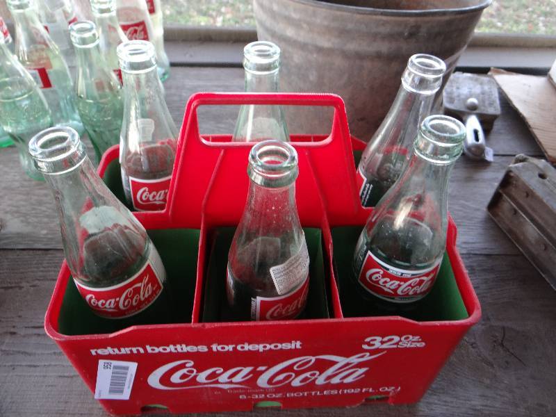lot 958 image: 6 pack of Coca Cola bottles and plastic carry case.