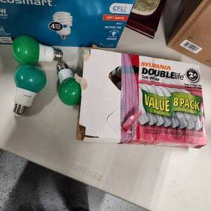 lot 257 image: Philips green light bulbs and Sylvania 60w light bulbs (qty 5)