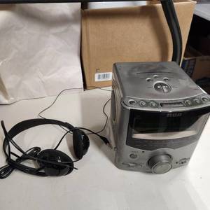lot 267 image: RCA Stereo CD clock radio and headphones